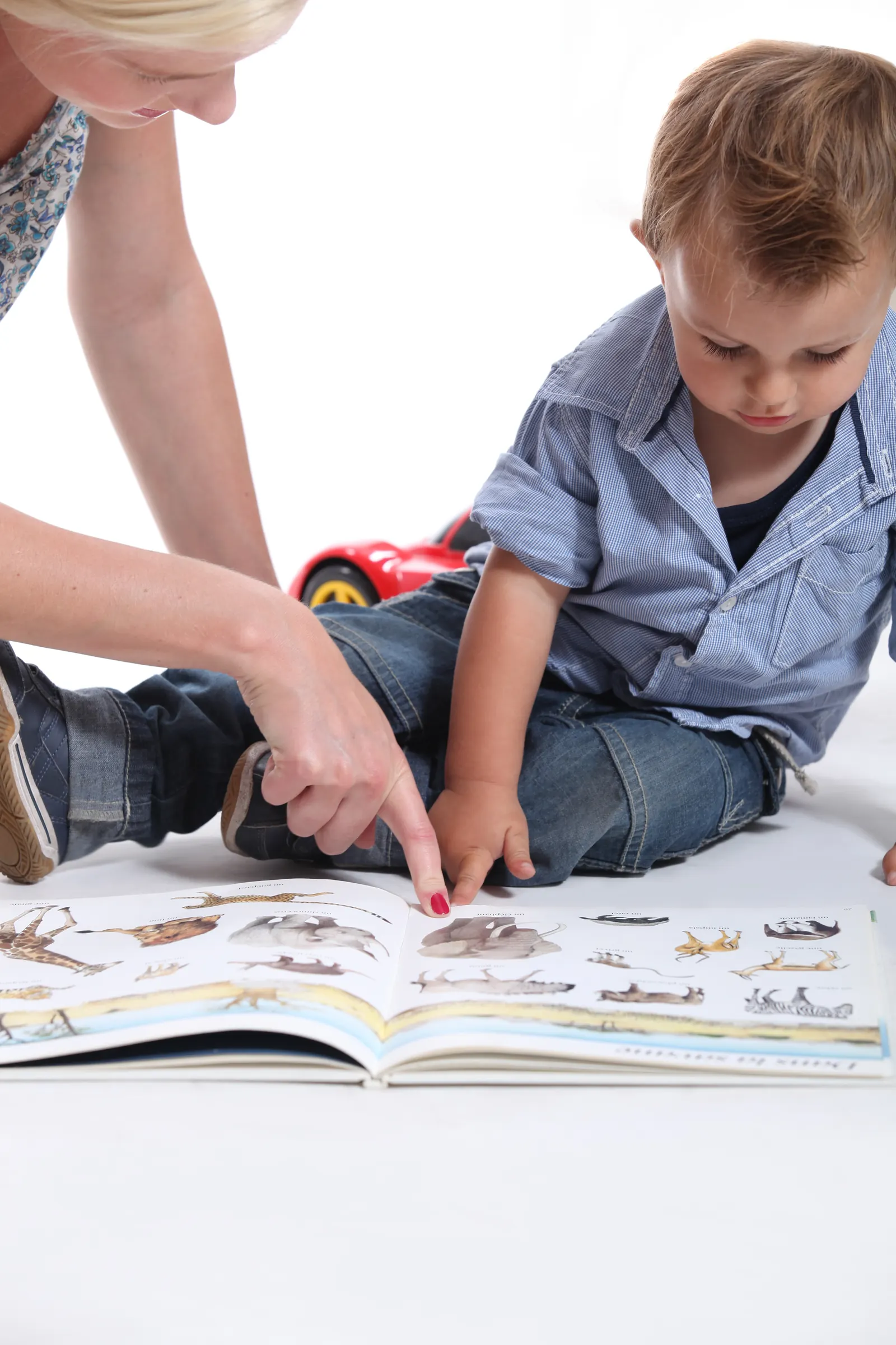Mother,And,Child,Looking,At,A,Book at Grace-Trinity Academy