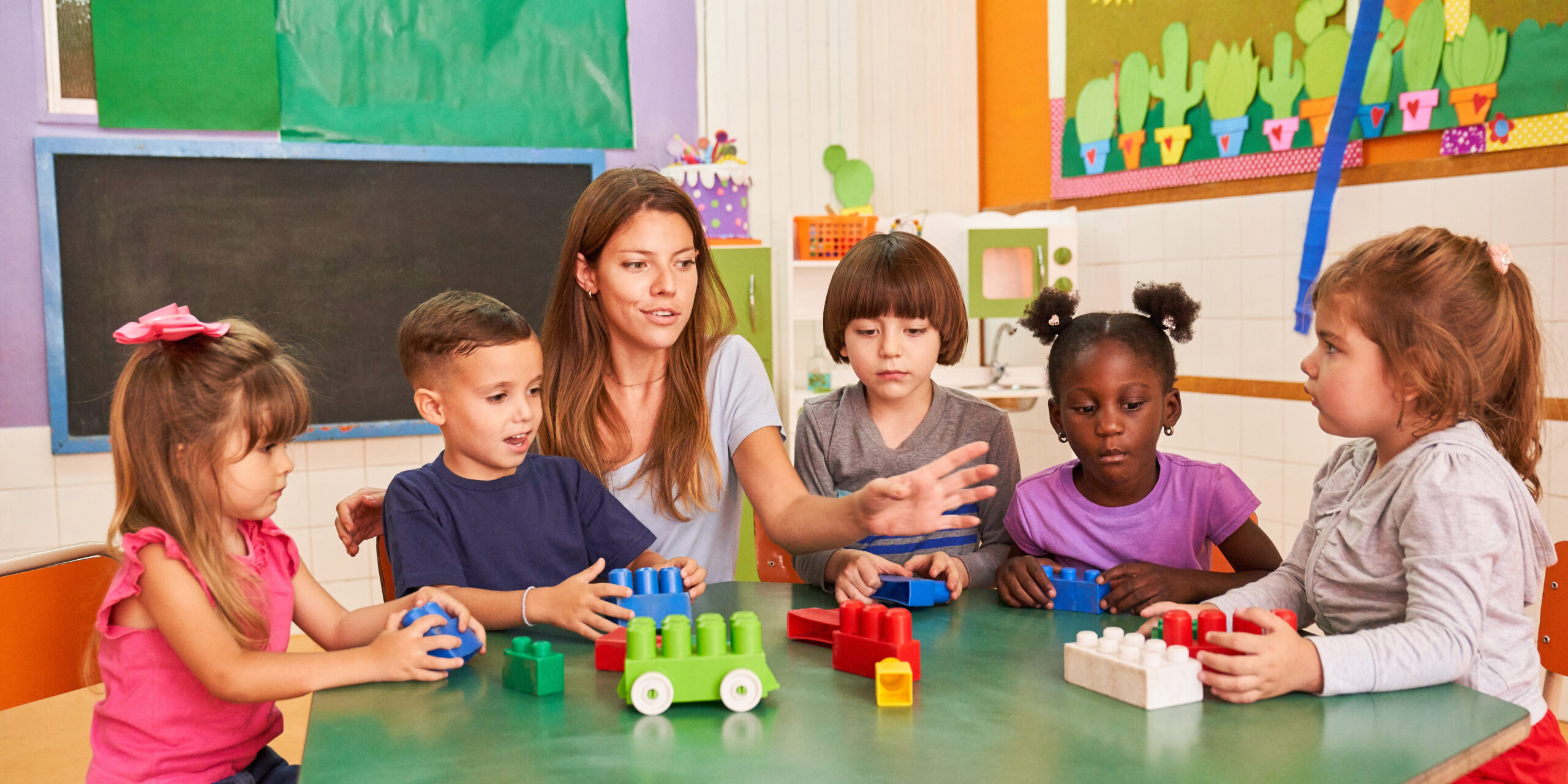 Group,Of,Children,Plays,With,Colorful,Building,Blocks,In,The Children at Grace-Trinity Academy Christian daycare